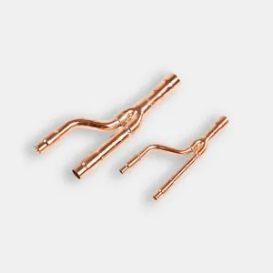A precisely engineered copper branch pipe, also known as a refnet joint, for VRF/VRV HVAC systems, highlighting its perfect welds and complex geometry on a clean background.